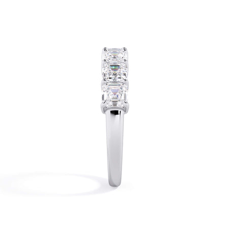 A picture of a seven stone diamond wedding ring with asscher cut diamonds that are shared prong set in white gold or platinum on a white background with a side profile view.