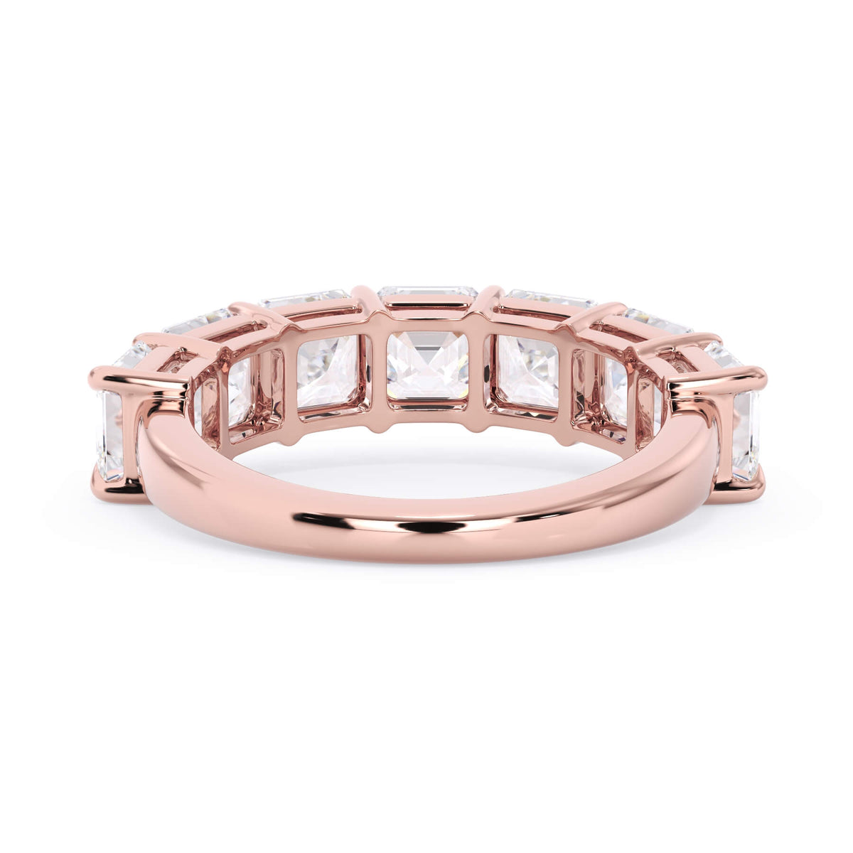A picture of a seven stone diamond wedding ring with asscher cut diamonds that are shared prong set in rose gold on a white background with a view of the underside of the ring.