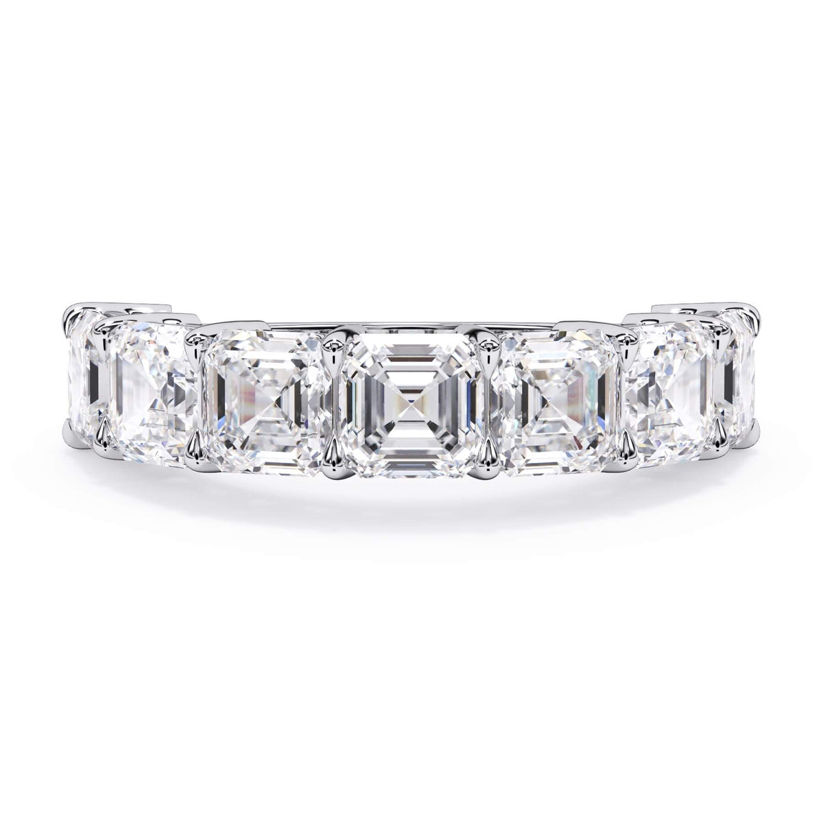A picture of a seven stone diamond wedding ring with asscher cut diamonds that are shared prong set in white gold or platinum on a white background with the ring facing forward, lying down.