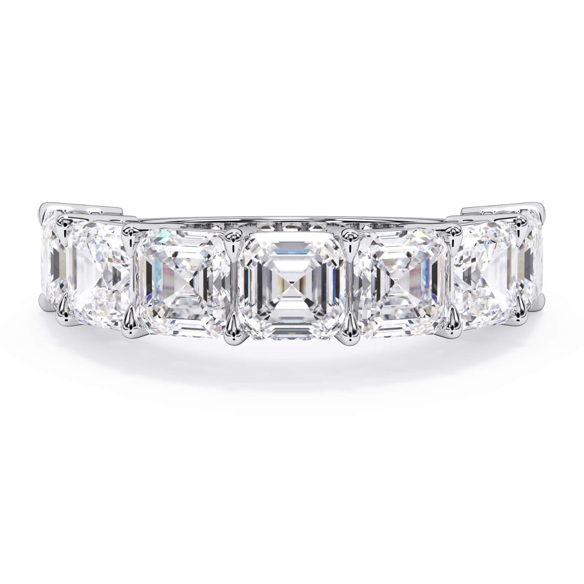 A picture of a seven stone diamond wedding ring with asscher cut diamonds that are shared prong set in white gold or platinum on a white background with the ring facing forward, lying down.