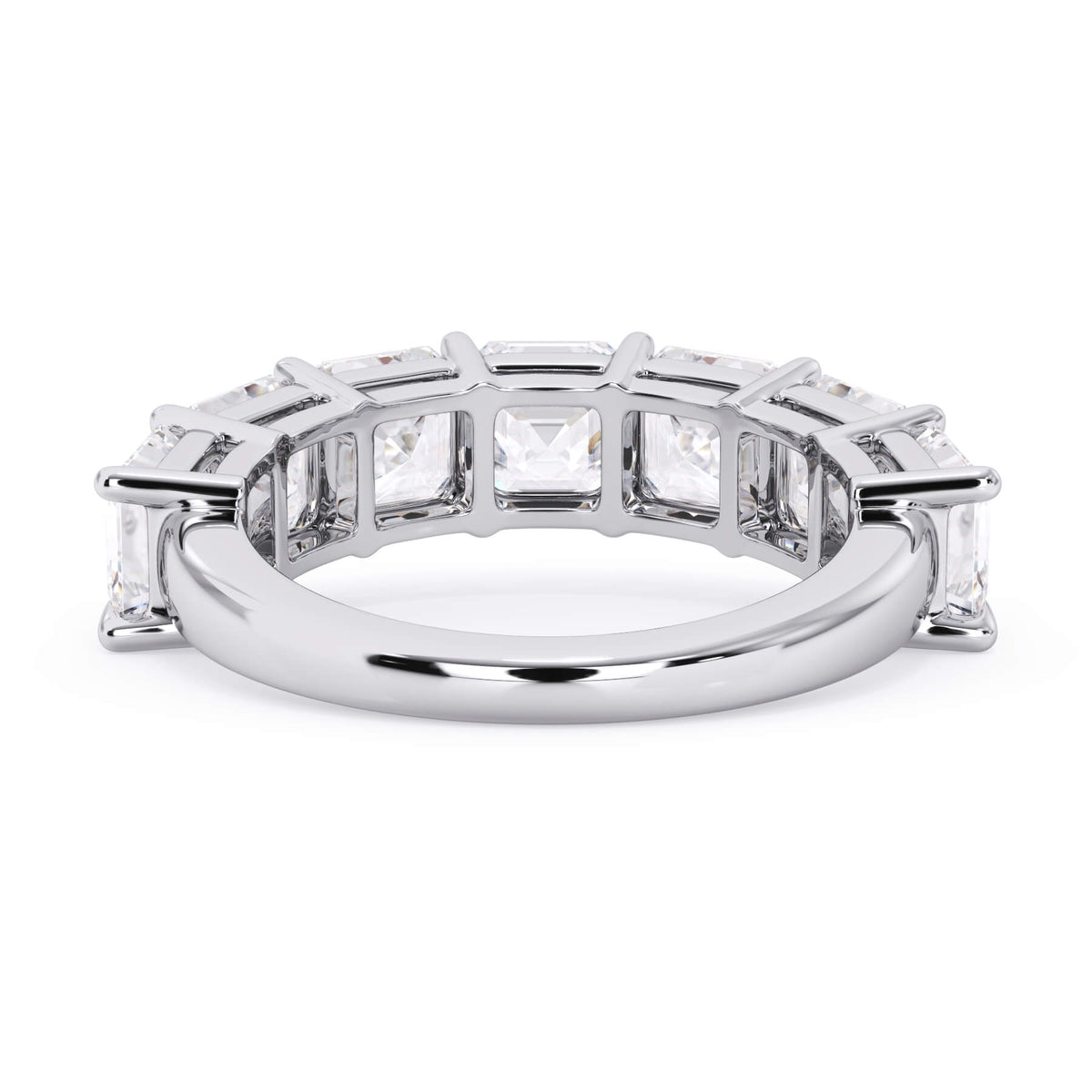 A picture of a seven stone diamond wedding ring with asscher cut diamonds that are shared prong set in white gold or platinum on a white background with a view of the underside of the ring.