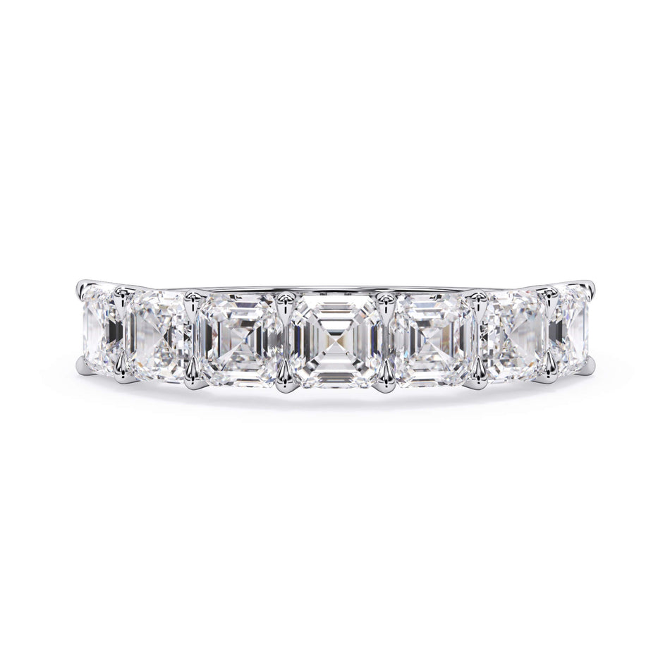 A picture of a seven stone diamond wedding ring with asscher cut diamonds that are U prong set in white gold or platinum on a white background with the ring facing forward, lying down.