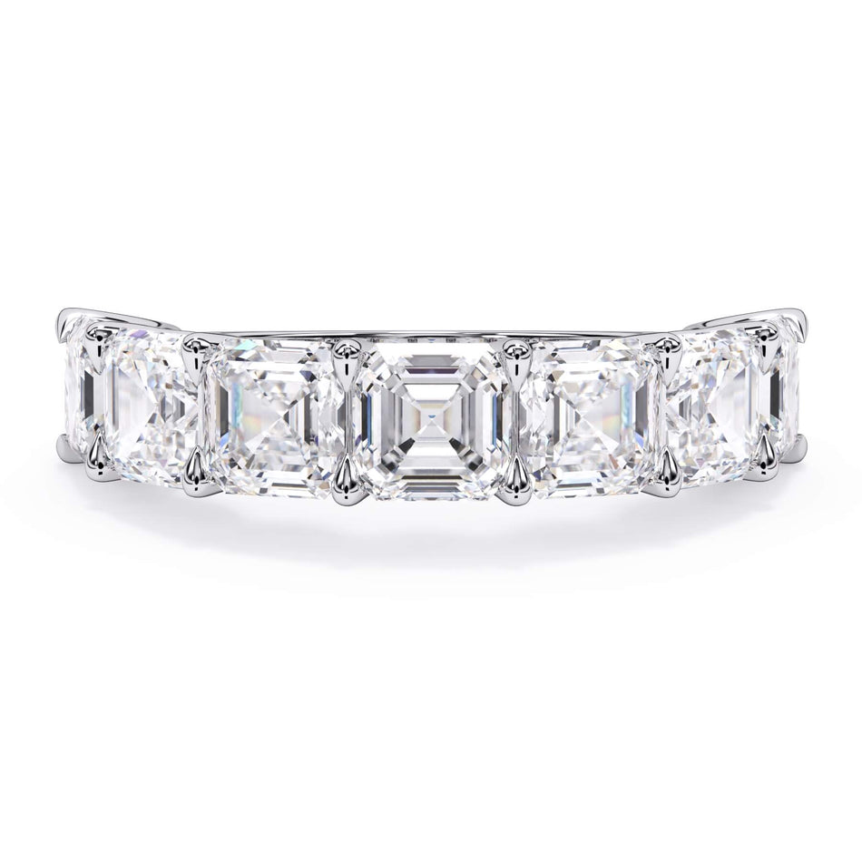 A picture of a seven stone diamond wedding ring with asscher cut diamonds that are U prong set in white gold or platinum on a white background with the ring facing forward, lying down.