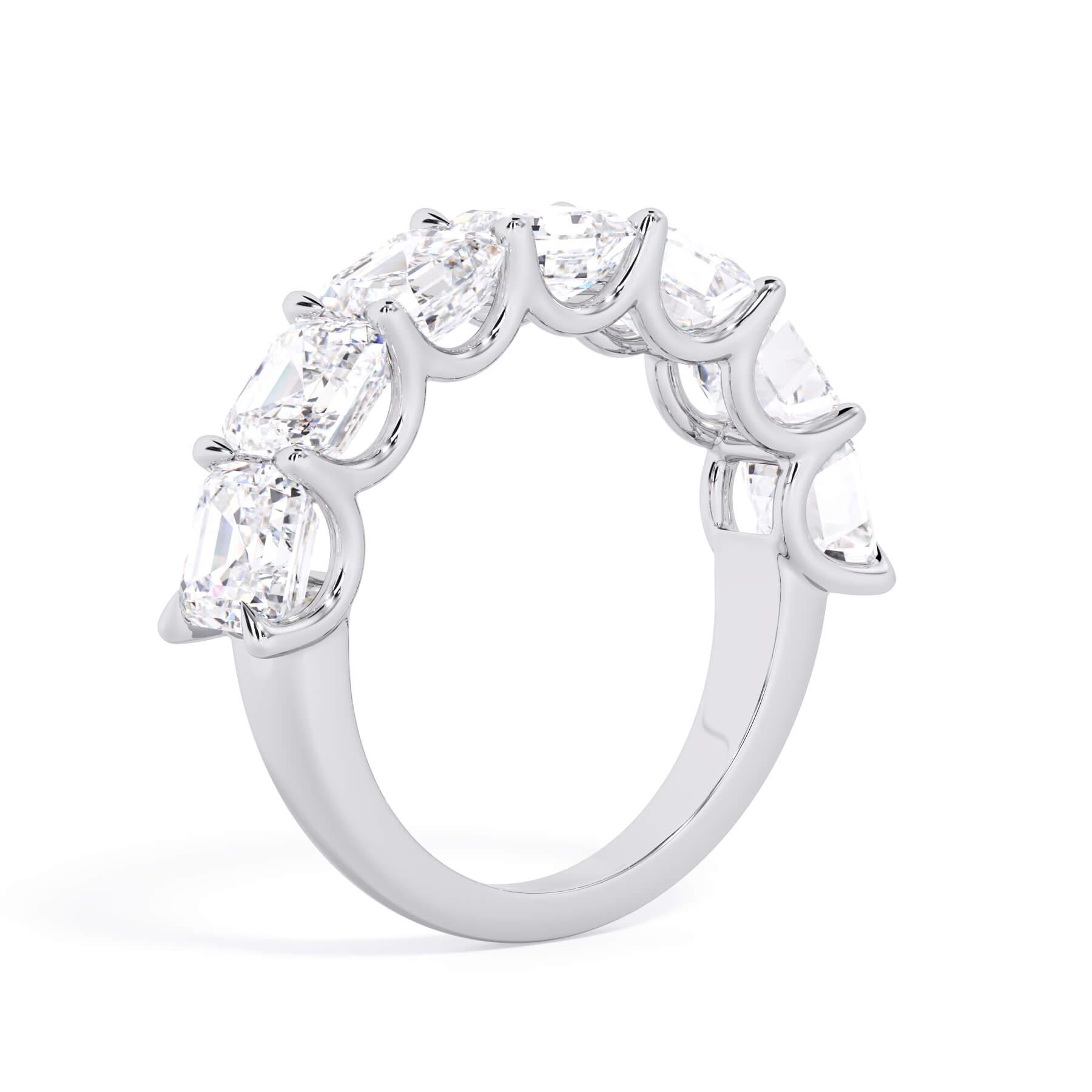 A picture of a seven stone diamond wedding ring with asscher cut diamonds that are U prong set in white gold or platinum on a white background with a slightly angled, through the finger view.
