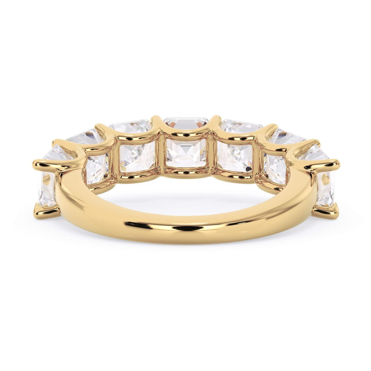 A picture of a seven stone diamond wedding ring with asscher cut diamonds that are U prong set in yellow gold on a white background with a view of the underside of the ring.
