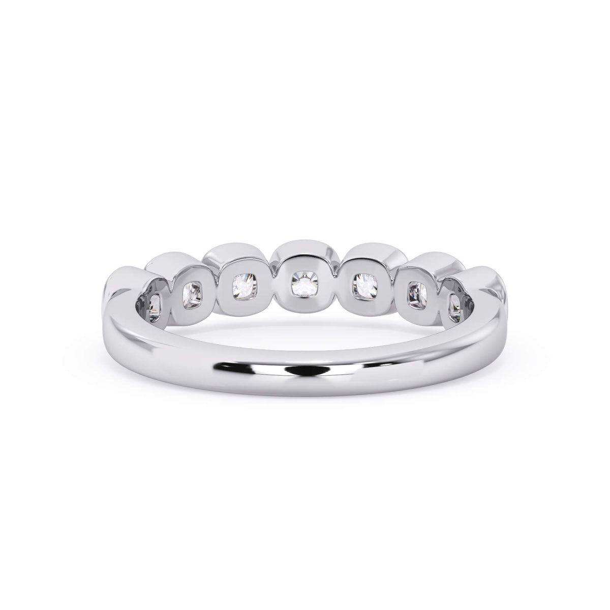 A picture of a seven stone diamond wedding ring with cushion cut diamonds that are bezel set in white gold or platinum on a white background with a view of the underside of the ring.