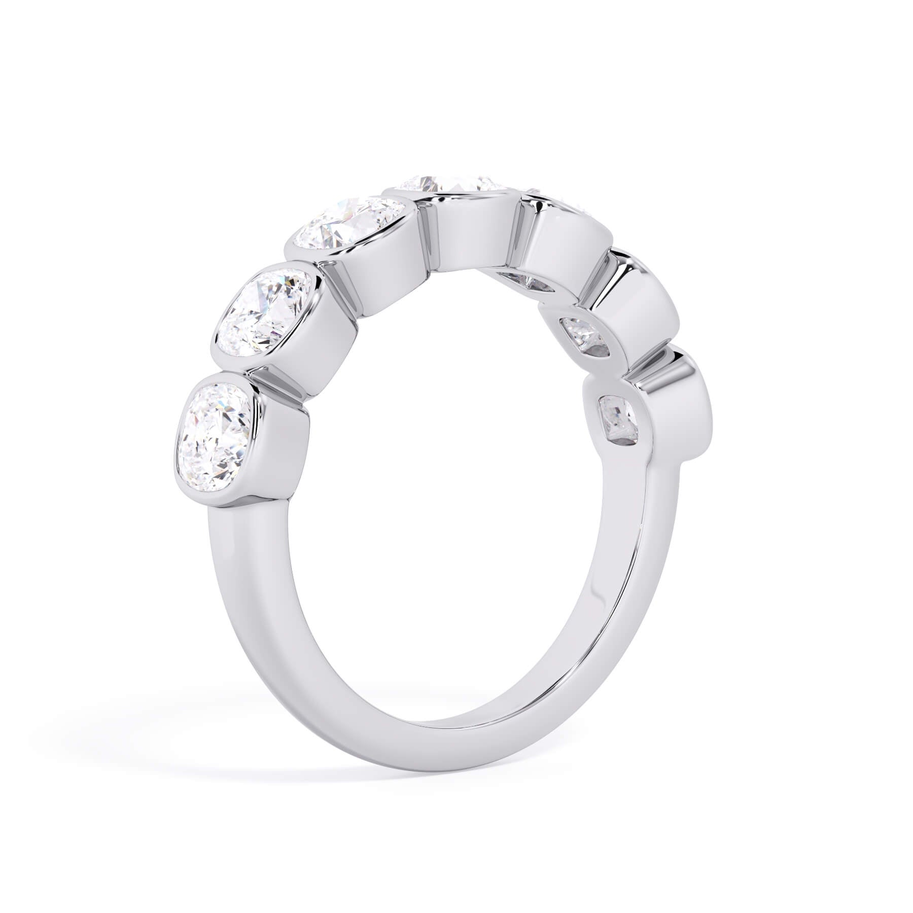 A picture of a seven stone diamond wedding ring with cushion cut diamonds that are bezel set in white gold or platinum on a white background with the ring facing forward, lying down.