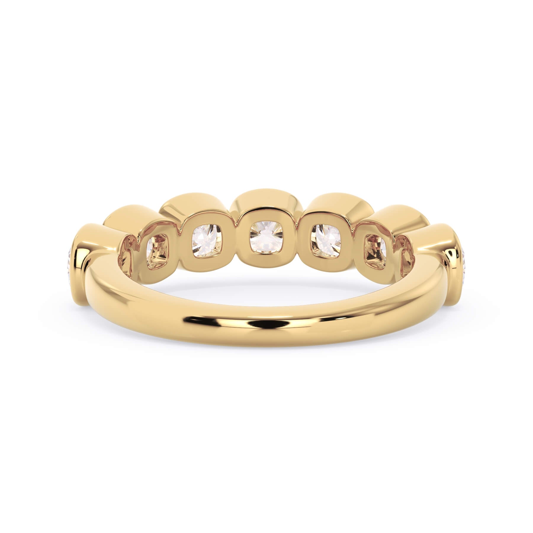 A picture of a seven stone diamond wedding ring with cushion cut diamonds that are bezel set in yellow gold on a white background with a view of the underside of the ring.