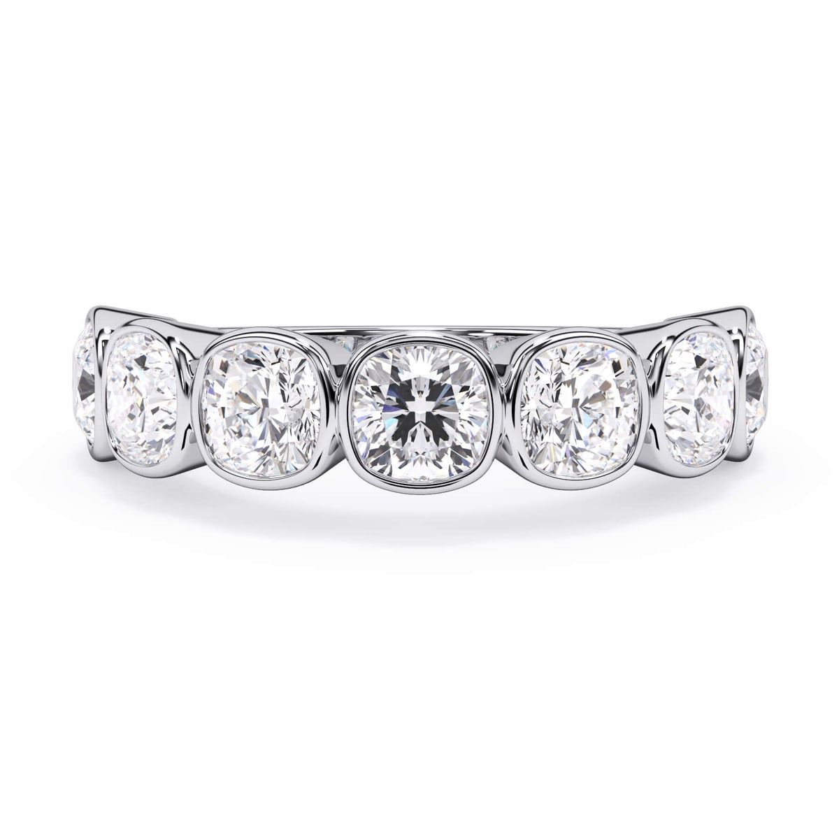 A picture of a seven stone diamond wedding ring with cushion cut diamonds that are bezel set in white gold or platinum on a white background with the ring facing forward, lying down.