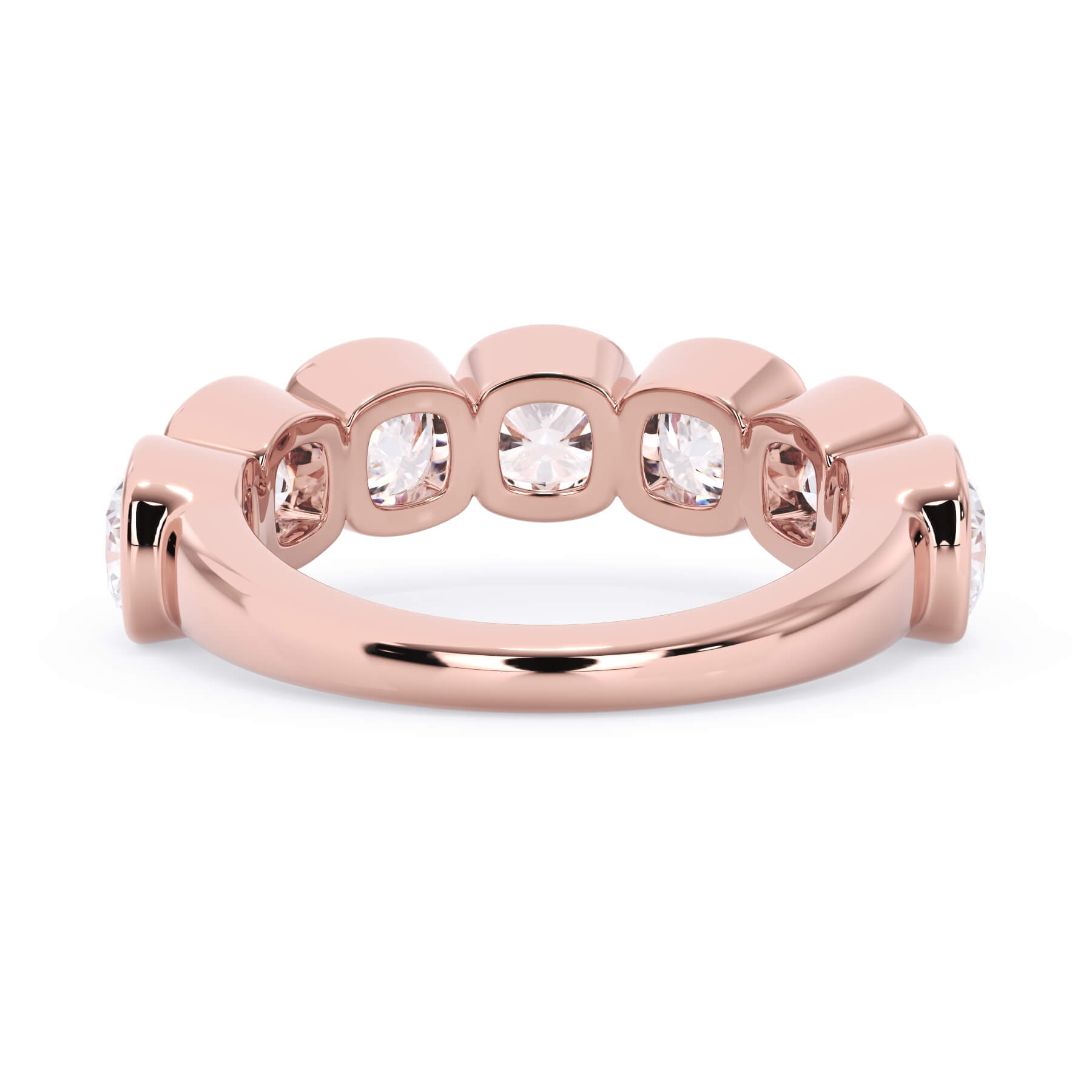 A picture of a seven stone diamond wedding ring with cushion cut diamonds that are bezel set in rose gold on a white background with a view of the underside of the ring.