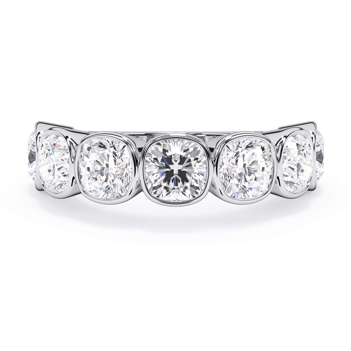 A picture of a seven stone diamond wedding ring with cushion cut diamonds that are bezel set in white gold or platinum on a white background with the ring facing forward, lying down.
