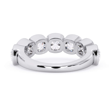 A picture of a seven stone diamond wedding ring with cushion cut diamonds that are bezel set in white gold or platinum on a white background with a view of the underside of the ring.