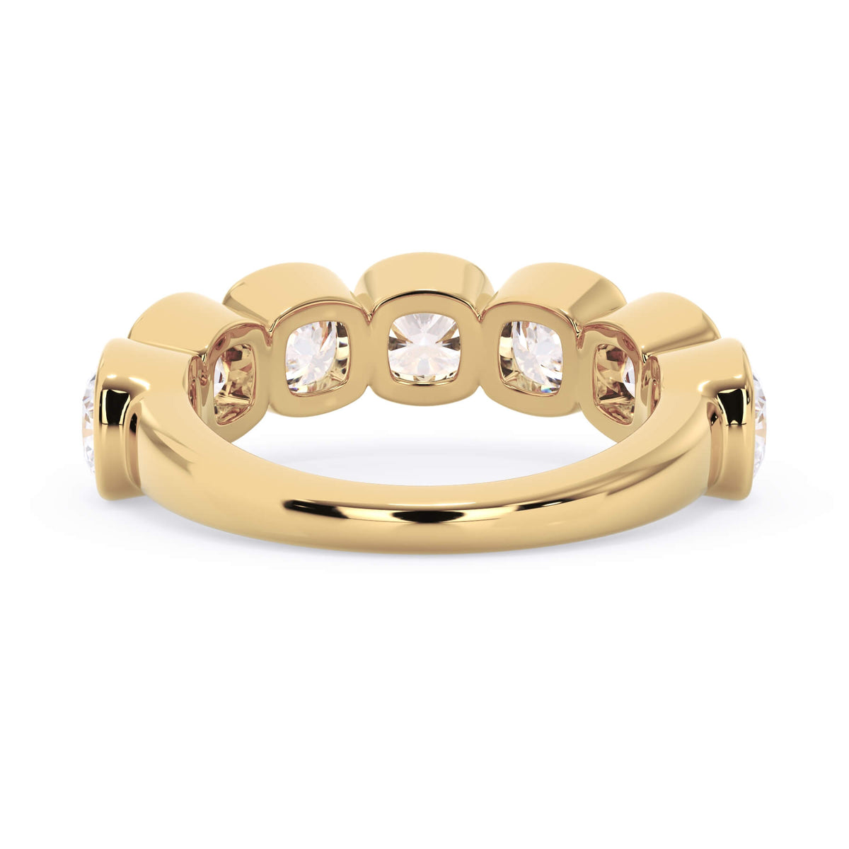 A picture of a seven stone diamond wedding ring with cushion cut diamonds that are bezel set in yellow gold on a white background with a view of the underside of the ring.