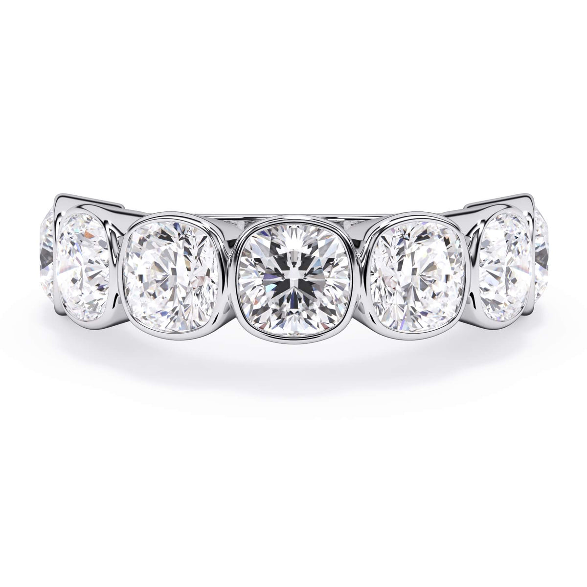 A picture of a seven stone diamond wedding ring with cushion cut diamonds that are bezel set in white gold or platinum on a white background with the ring facing forward, lying down.