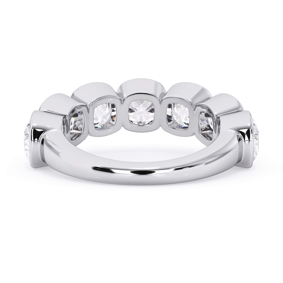 A picture of a seven stone diamond wedding ring with cushion cut diamonds that are bezel set in white gold or platinum on a white background with a view of the underside of the ring.