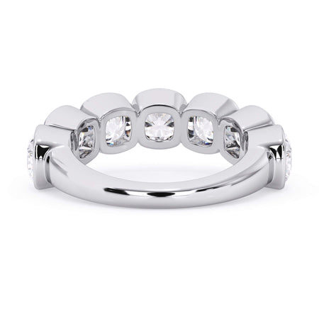 A picture of a seven stone diamond wedding ring with cushion cut diamonds that are bezel set in white gold or platinum on a white background with a view of the underside of the ring.