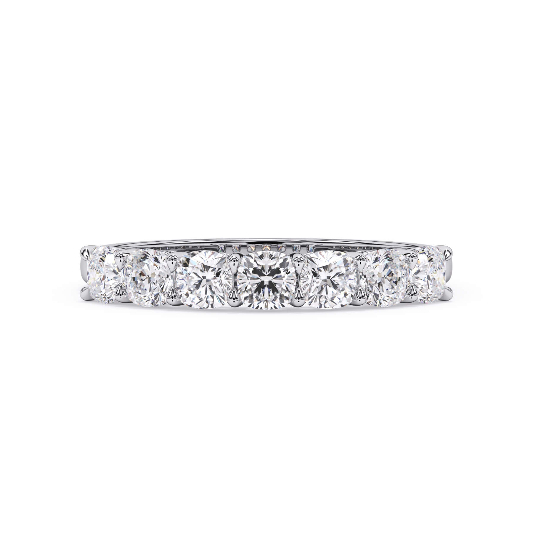 A picture of a seven stone diamond wedding ring with cushion cut diamonds that are shared prong set in white gold or platinum on a white background with the ring facing forward, lying down.
