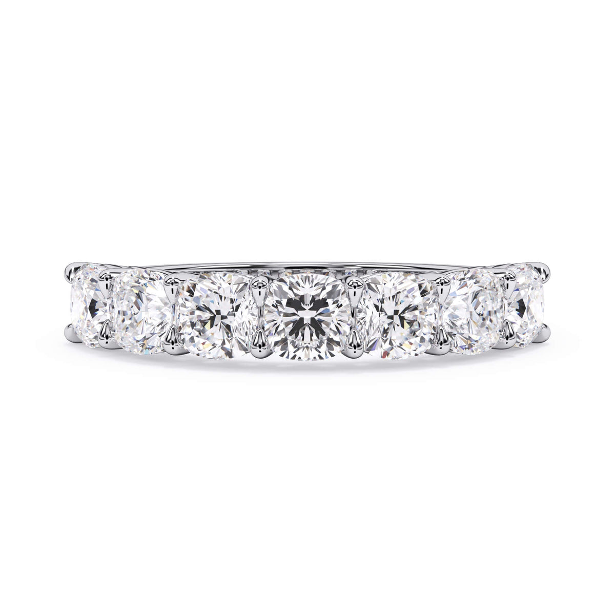 A picture of a seven stone diamond wedding ring with cushion cut diamonds that are shared prong set in white gold or platinum on a white background with the ring facing forward, lying down.