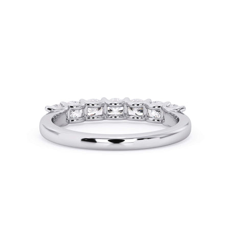 A picture of a seven stone diamond wedding ring with cushion cut diamonds that are U prong set in white gold or platinum on a white background with a view of the underside of the ring.