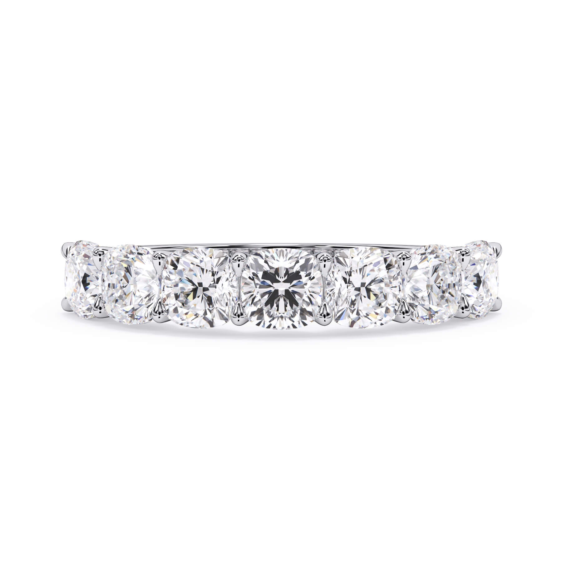 A picture of a seven stone diamond wedding ring with cushion cut diamonds that are U prong set in white gold or platinum on a white background with the ring facing forward, lying down.