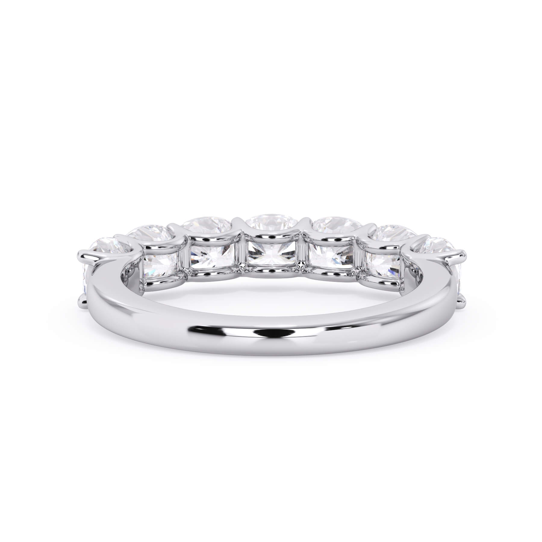 A picture of a seven stone diamond wedding ring with cushion cut diamonds that are U prong set in white gold or platinum on a white background with a view of the underside of the ring.