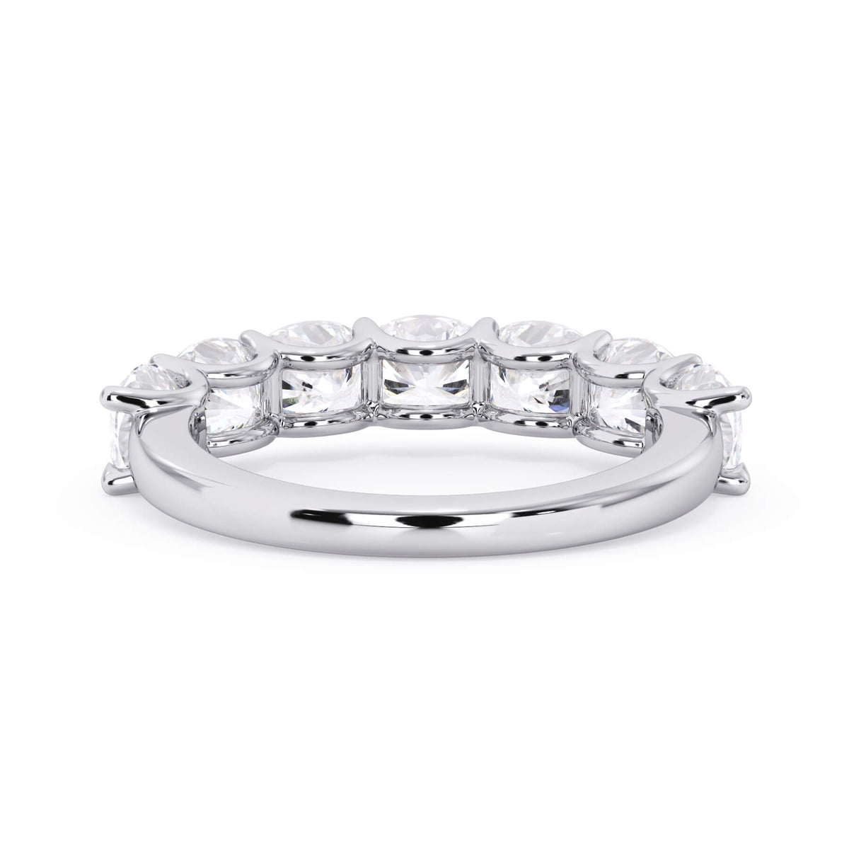 A picture of a seven stone diamond wedding ring with cushion cut diamonds that are U prong set in white gold or platinum on a white background with a view of the underside of the ring.