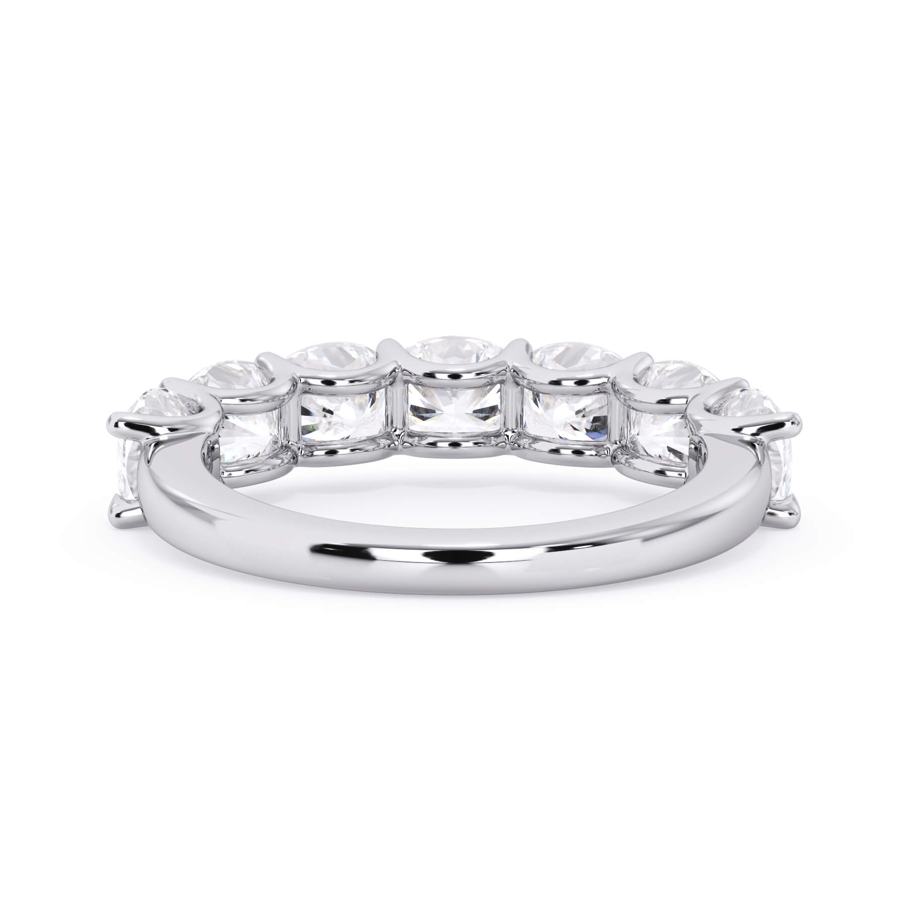 A picture of a seven stone diamond wedding ring with cushion cut diamonds that are U prong set in white gold or platinum on a white background with a view of the underside of the ring.