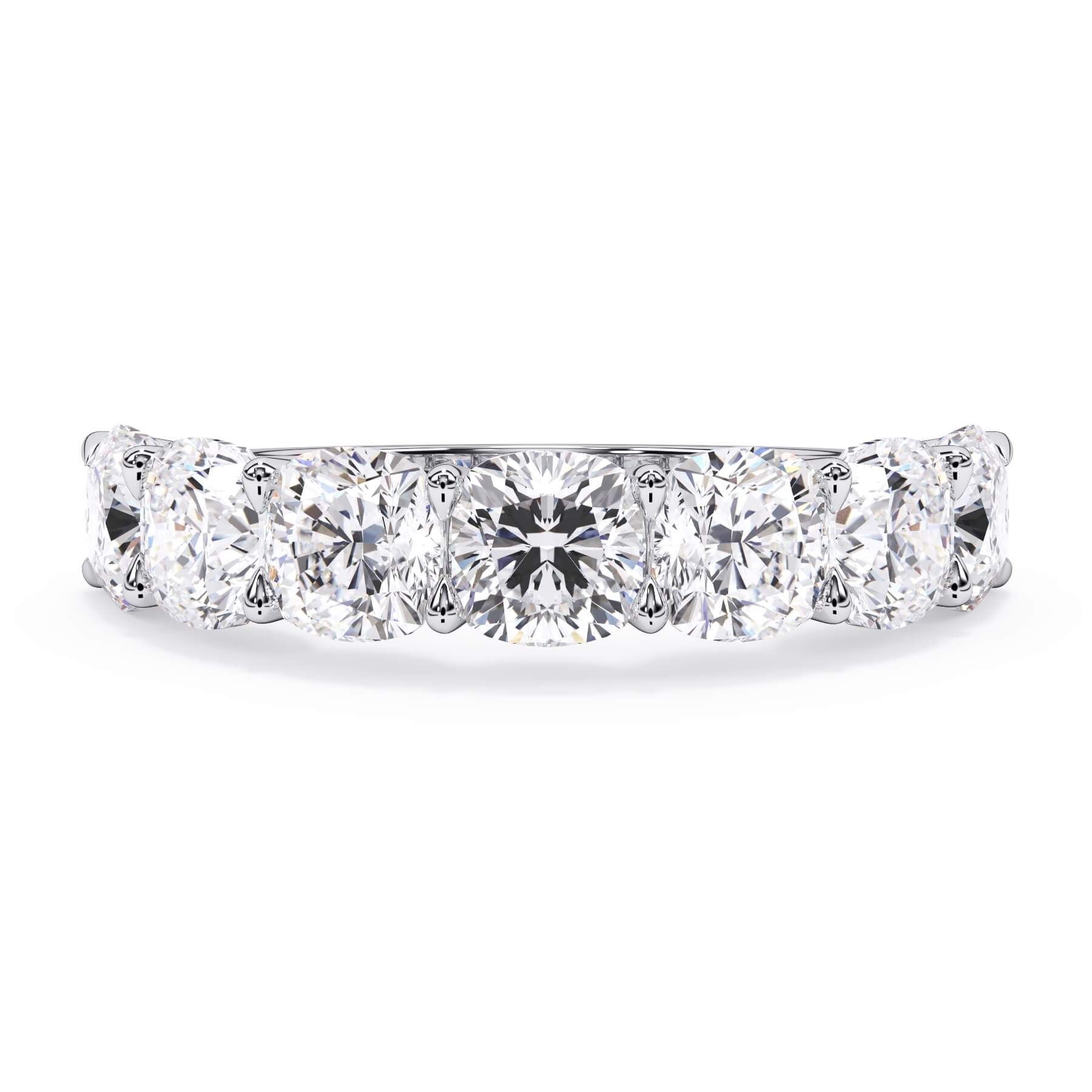 A picture of a seven stone diamond wedding ring with cushion cut diamonds that are U prong set in white gold or platinum on a white background with the ring facing forward, lying down.