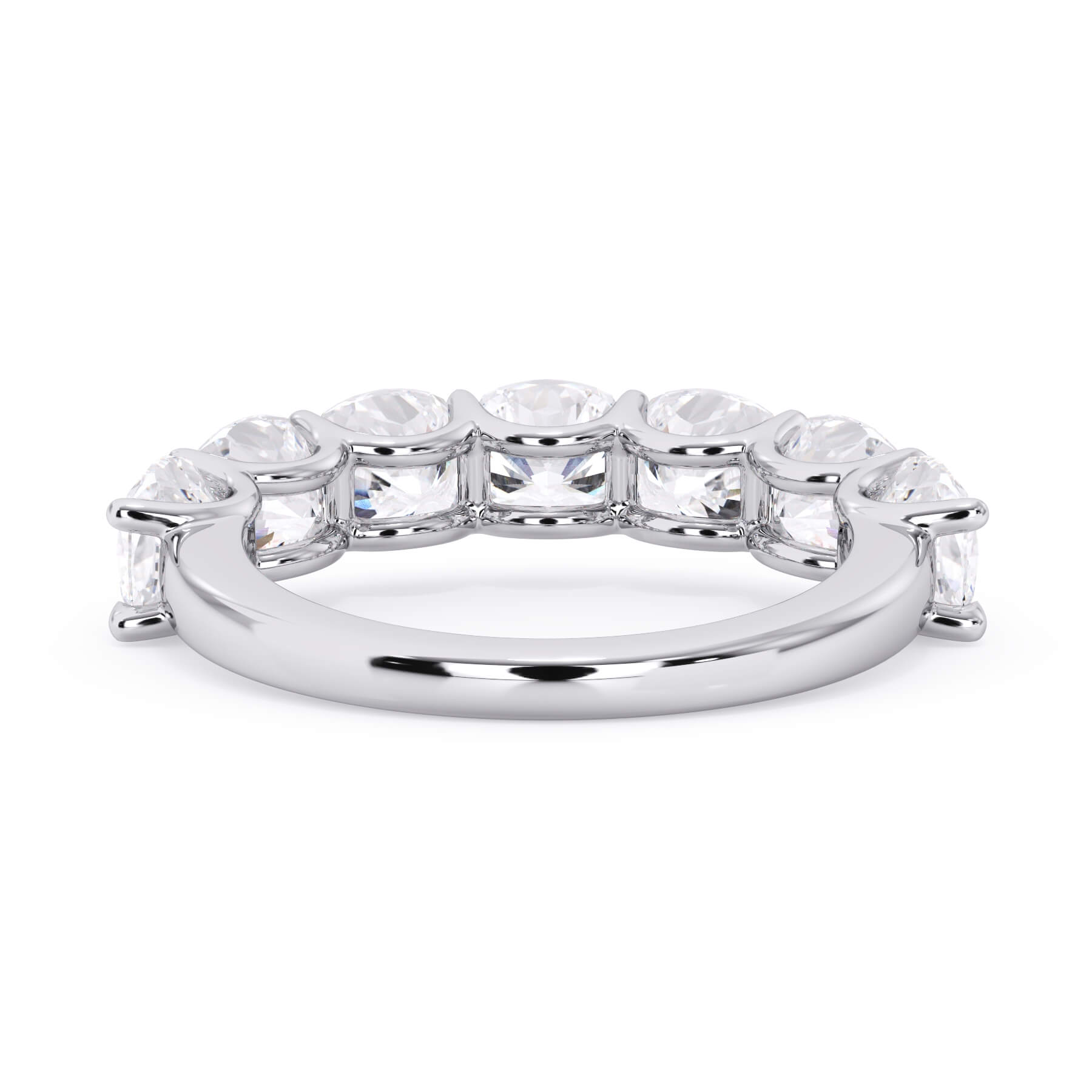 A picture of a seven stone diamond wedding ring with cushion cut diamonds that are U prong set in white gold or platinum on a white background with a view of the underside of the ring.
