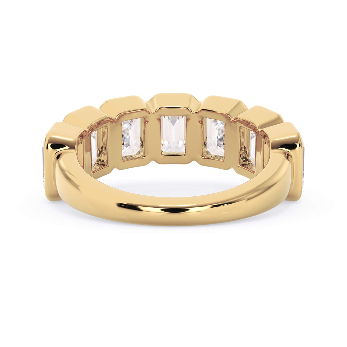 A picture of a seven stone diamond wedding ring with emerald cut diamonds that are bezel set in yellow gold on a white background with a view of the underside of the ring.