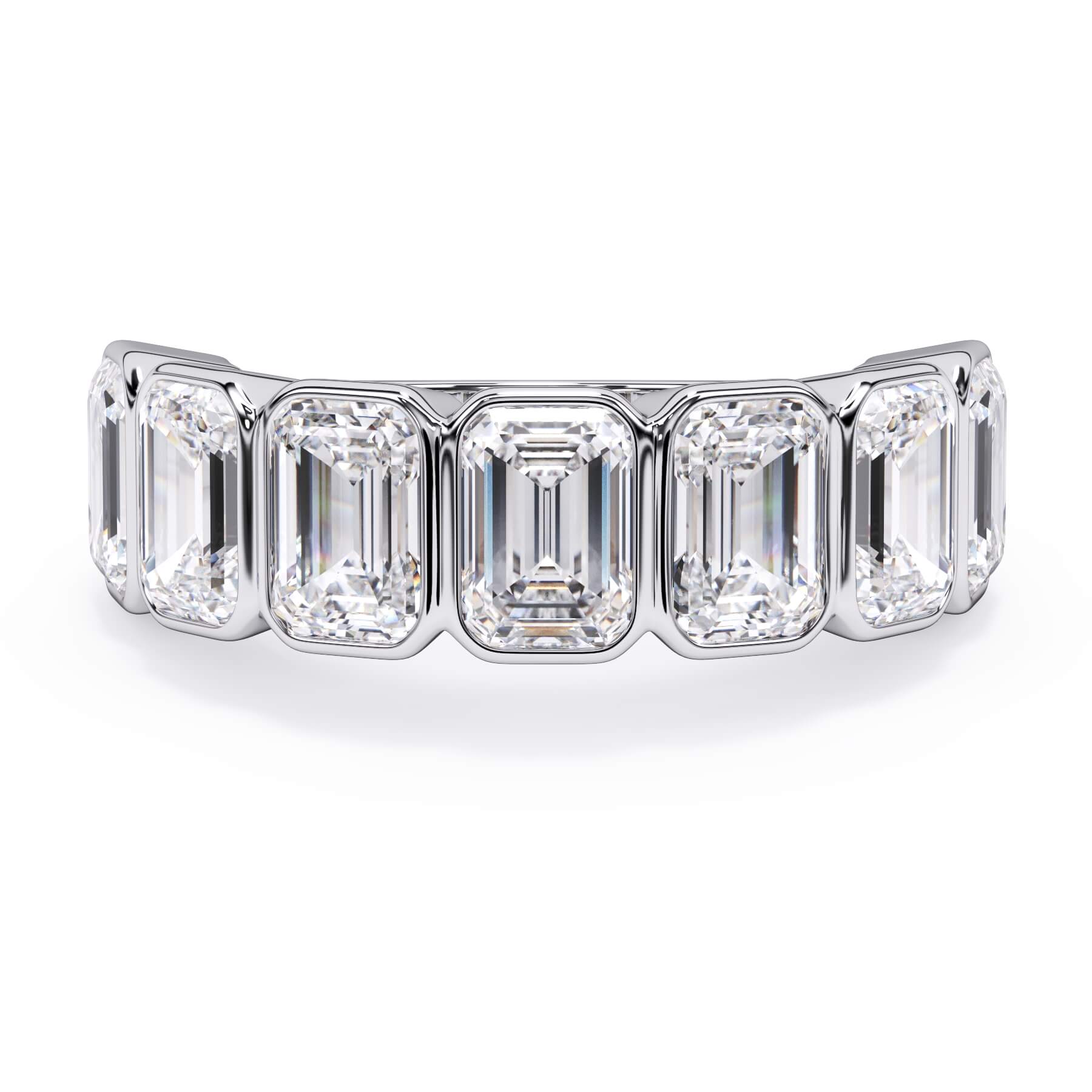 A picture of a seven stone diamond wedding ring with emerald cut diamonds that are bezel set in white gold or platinum on a white background with the ring facing forward, lying down.