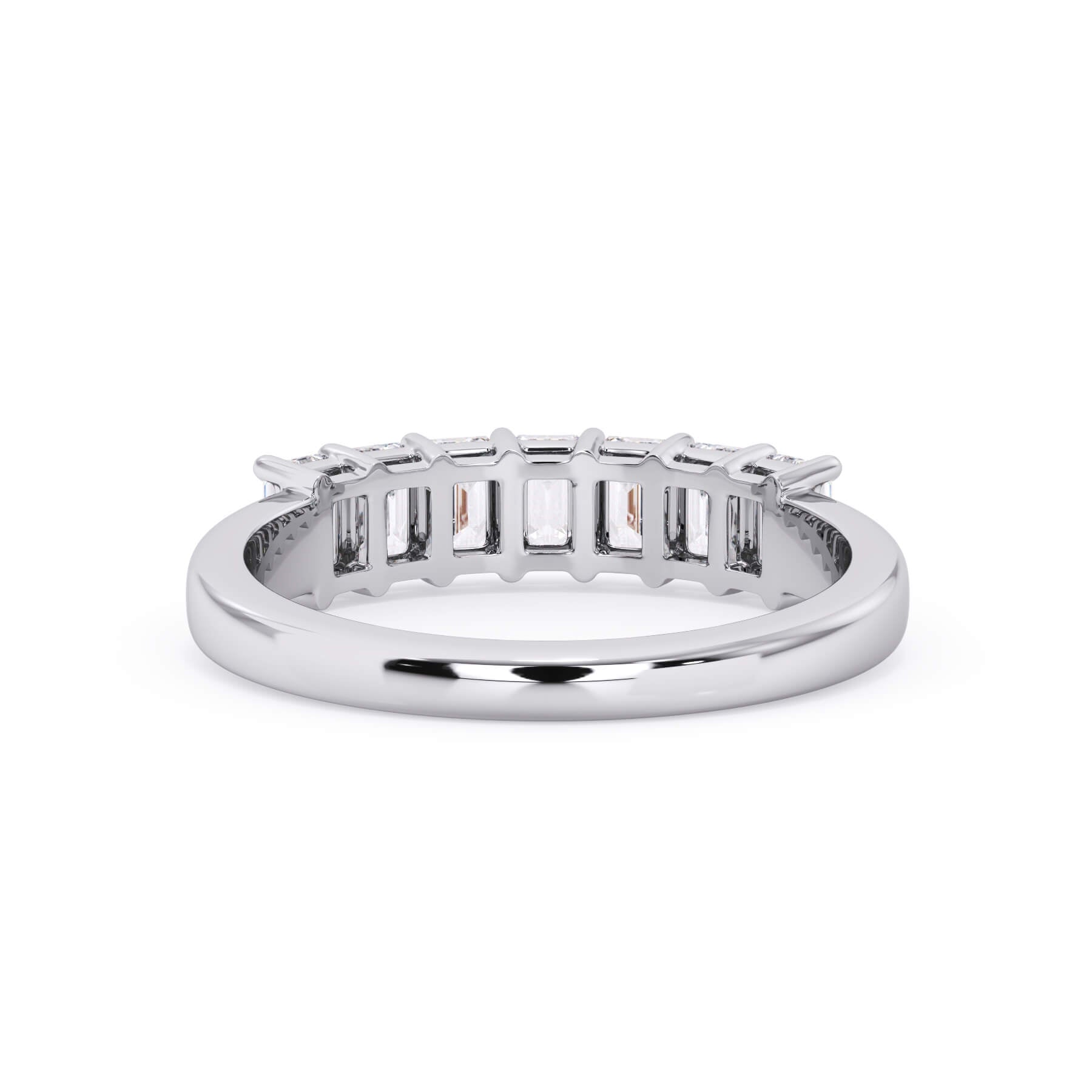 A picture of a seven stone diamond wedding ring with emerald cut diamonds that are shared prong set in white gold or platinum on a white background with a view of the underside of the ring.