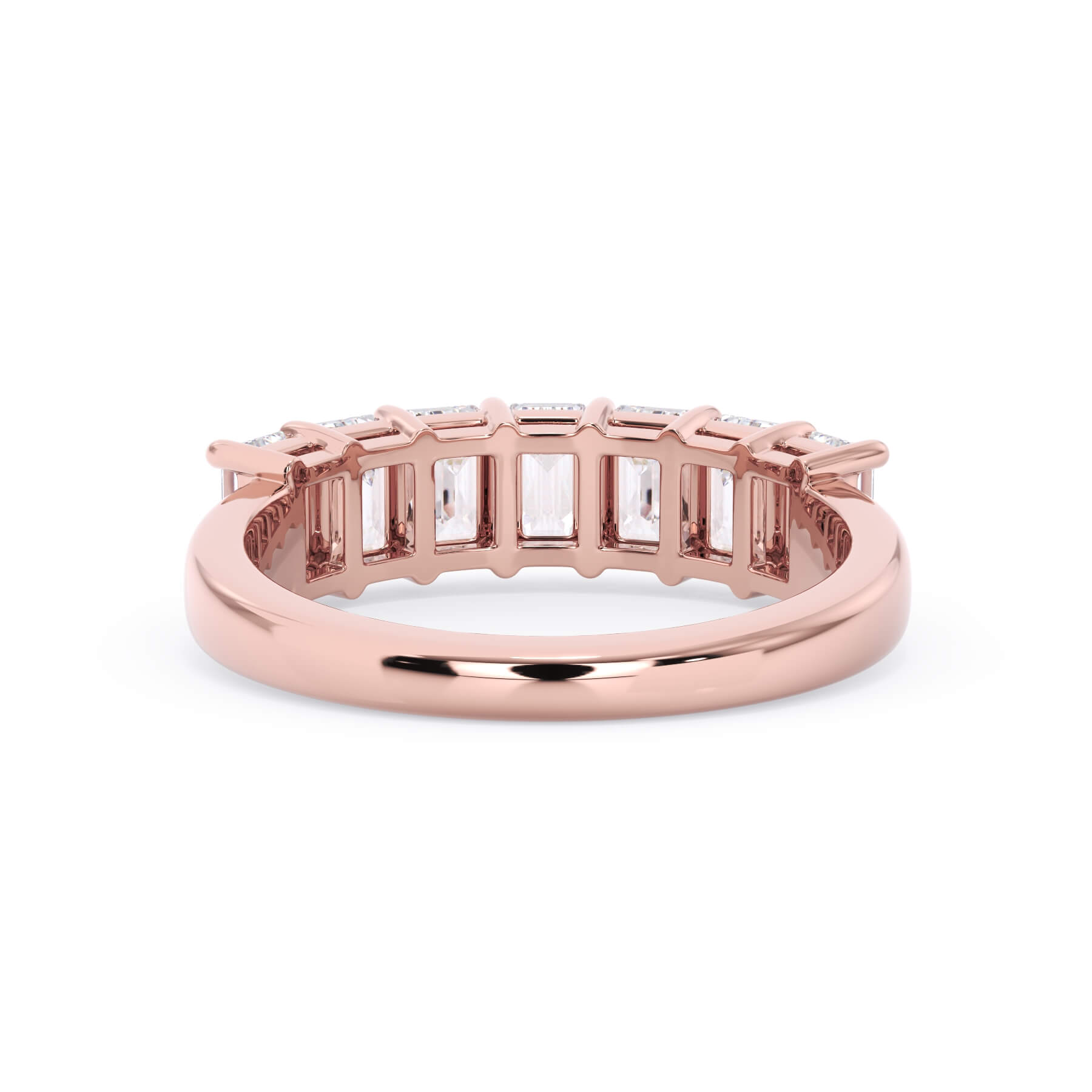 A picture of a seven stone diamond wedding ring with emerald cut diamonds that are shared prong set in rose gold on a white background with a view of the underside of the ring.