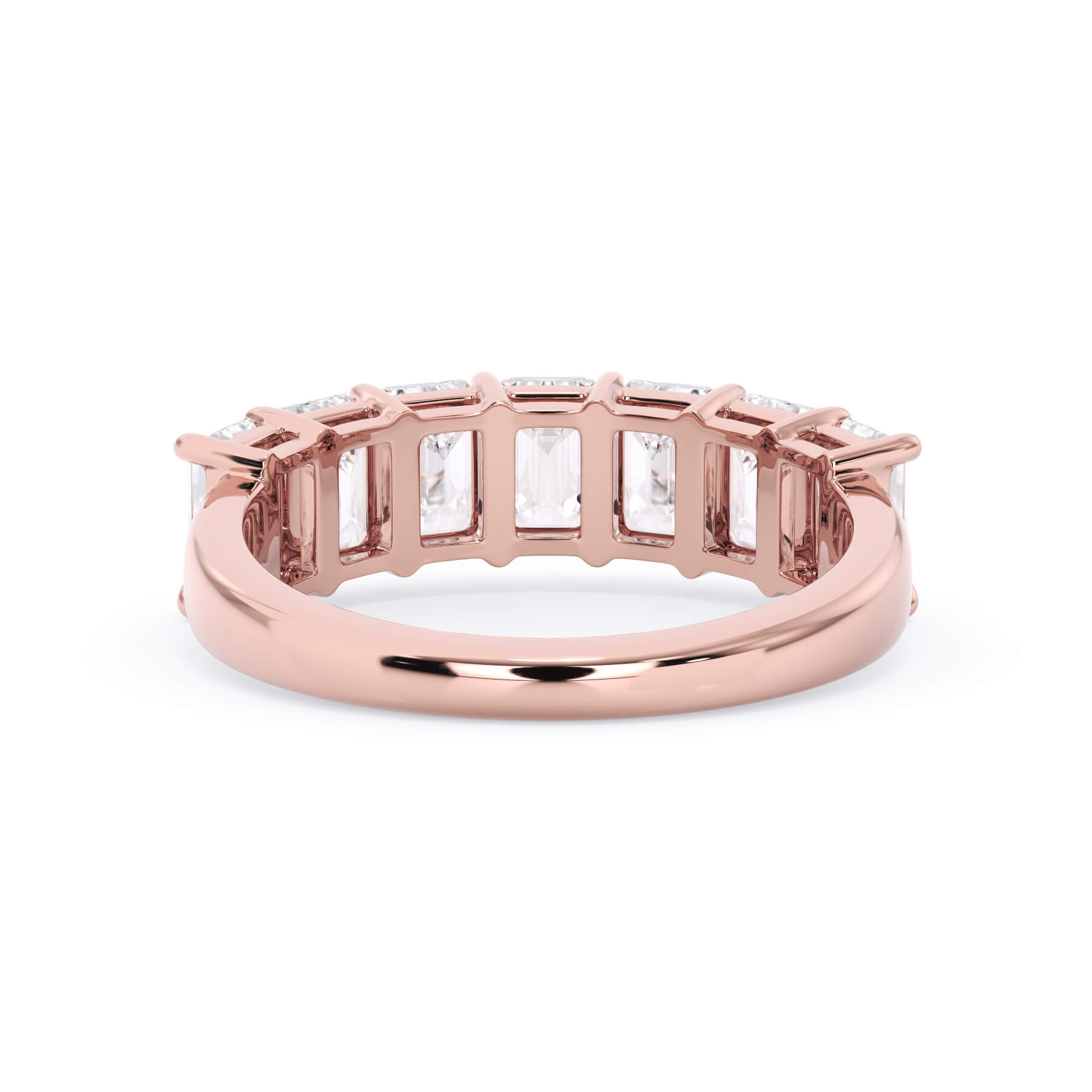 A picture of a seven stone diamond wedding ring with emerald cut diamonds that are shared prong set in rose gold on a white background with a view of the underside of the ring.