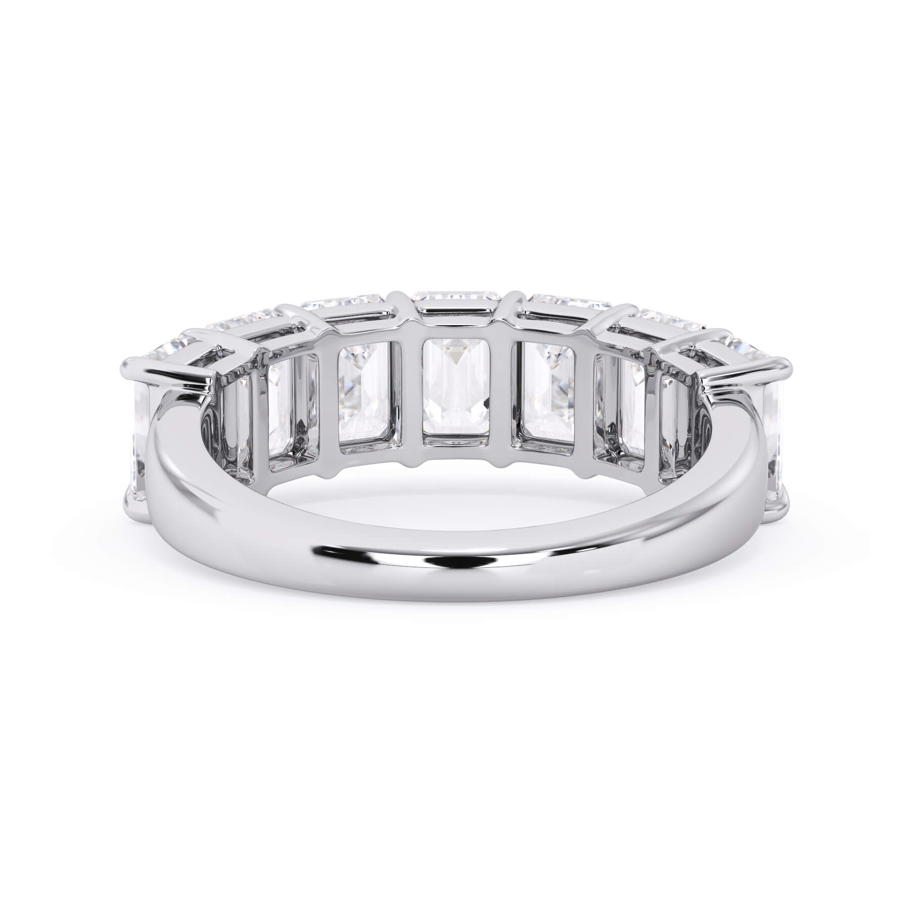 A picture of a seven stone diamond wedding ring with emerald cut diamonds that are shared prong set in white gold or platinum on a white background with a view of the underside of the ring.
