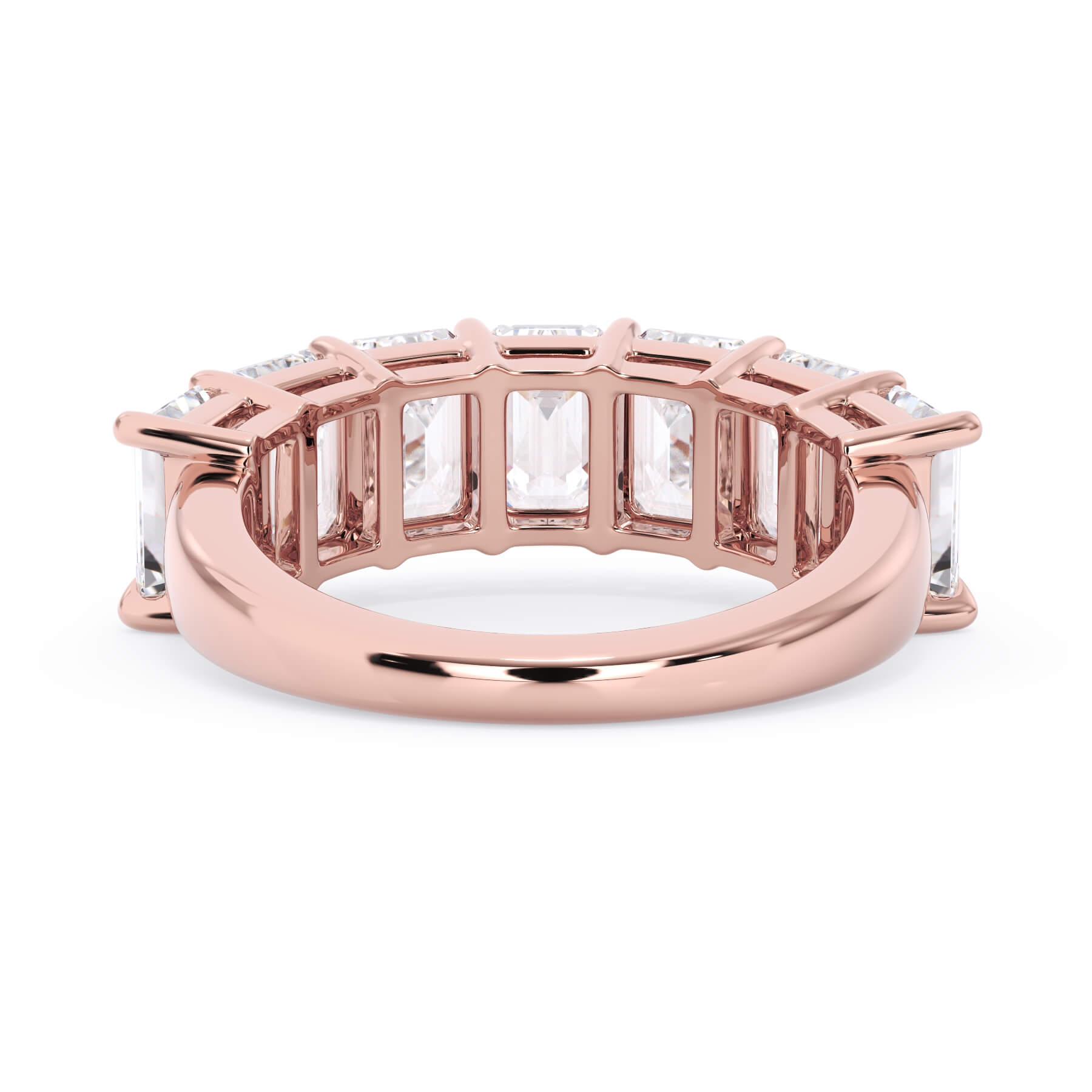 A picture of a seven stone diamond wedding ring with emerald cut diamonds that are shared prong set in rose gold on a white background with a view of the underside of the ring.