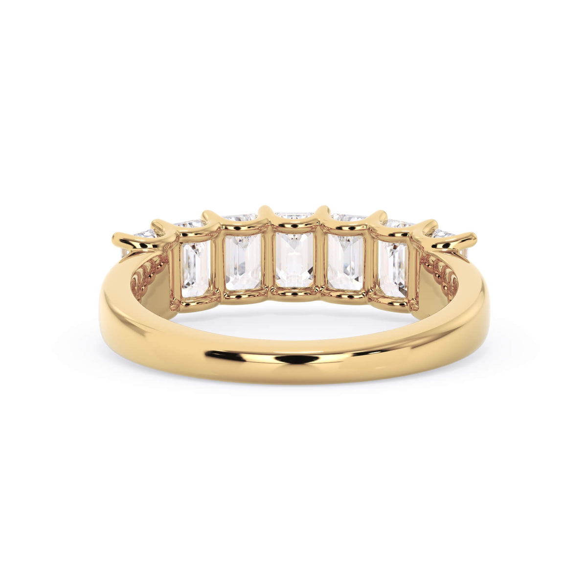 A picture of a seven stone diamond wedding ring with emerald cut diamonds that are U prong set in yellow gold on a white background with a view of the underside of the ring.