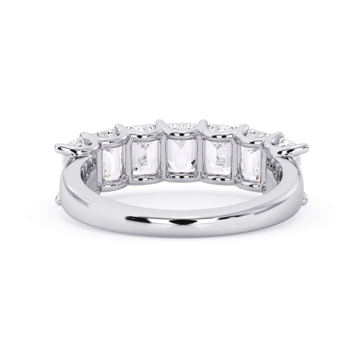A picture of a seven stone diamond wedding ring with emerald cut diamonds that are U prong set in white gold or platinum on a white background with a view of the underside of the ring.