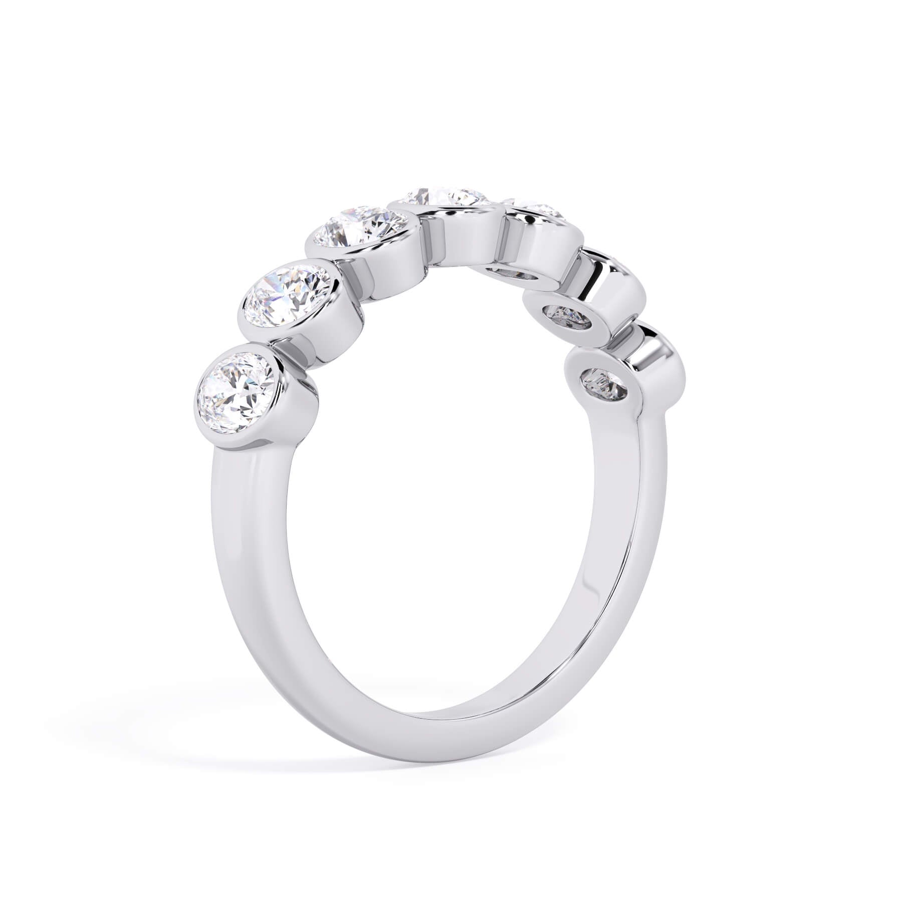 A picture of a seven stone diamond wedding ring with oval shaped diamonds that are bezel set in white gold or platinum on a white background with a slightly angled, through the finger view.