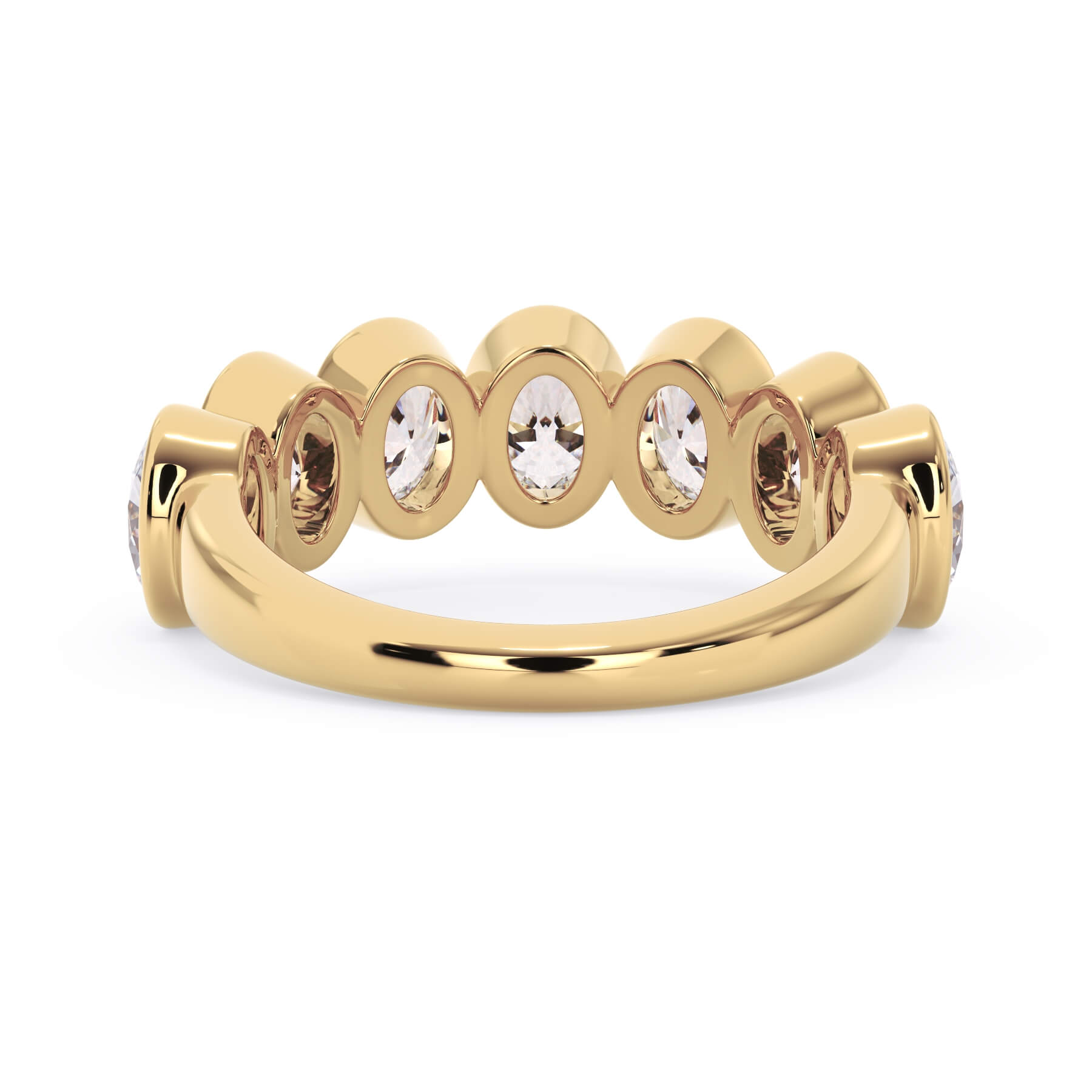 A picture of a seven stone diamond wedding ring with oval shaped diamonds that are bezel set in yellow gold on a white background with a view of the underside of the ring.