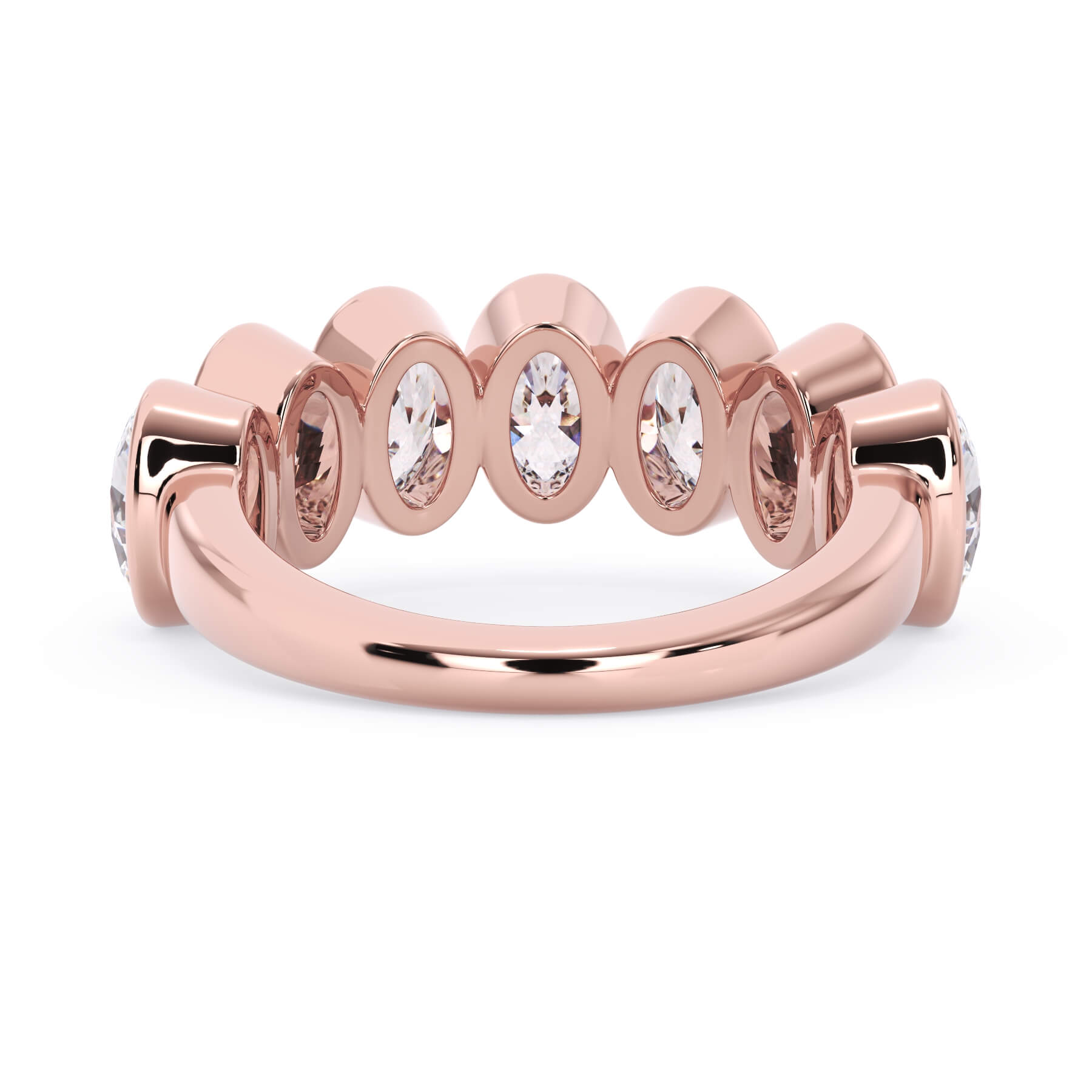 A picture of a seven stone diamond wedding ring with oval shaped diamonds that are bezel set in rose gold on a white background with a view of the underside of the ring.
