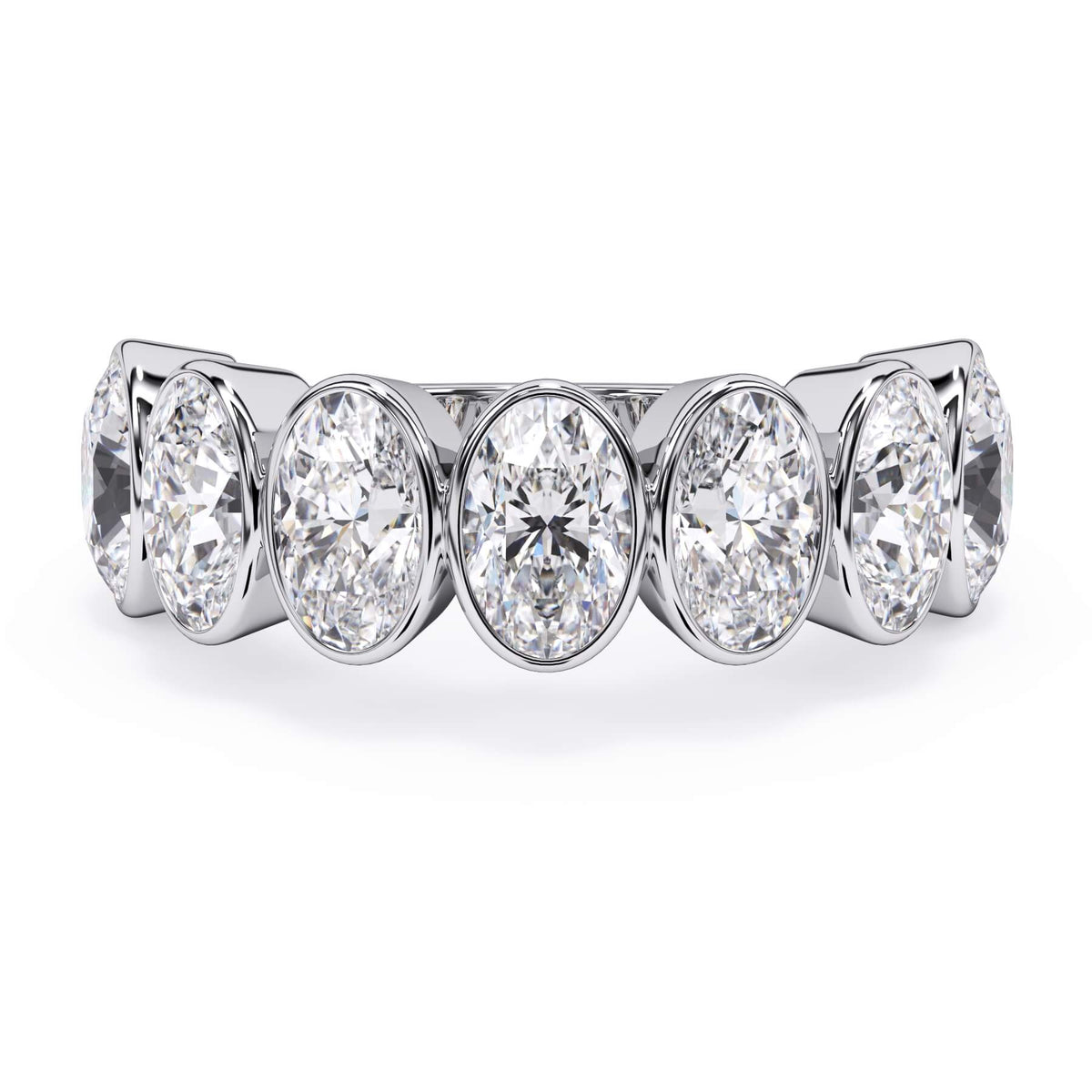 A picture of a seven stone diamond wedding ring with oval shaped diamonds that are bezel set in white gold or platinum on a white background with the ring facing forward, lying down.