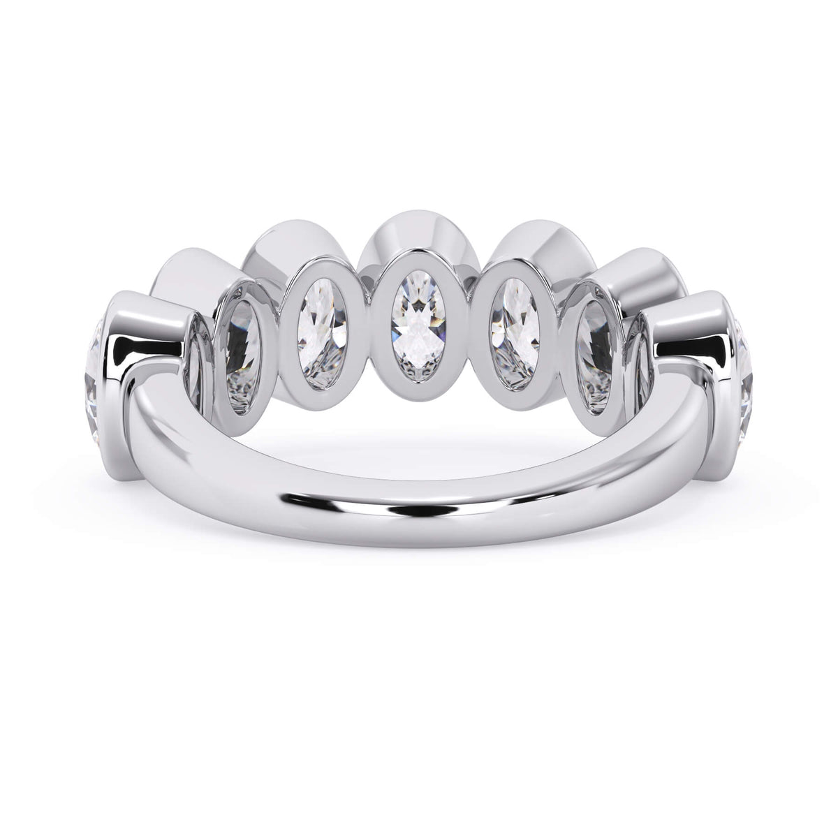 A picture of a seven stone diamond wedding ring with oval shaped diamonds that are bezel set in white gold or platinum on a white background with a view of the underside of the ring.