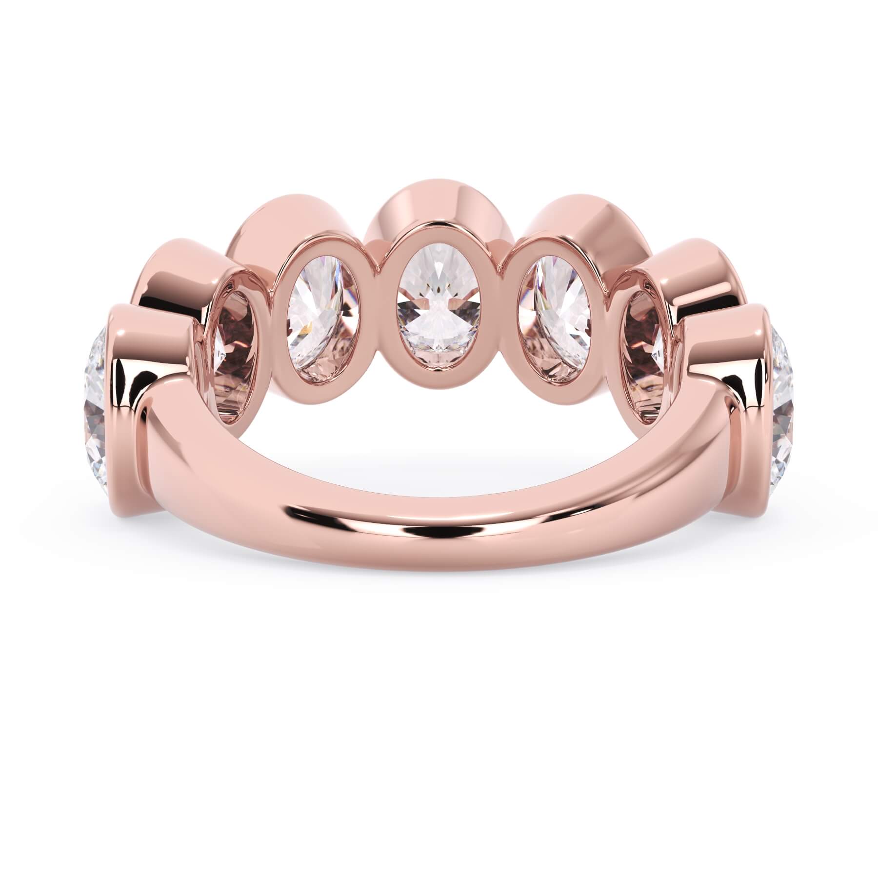 A picture of a seven stone diamond wedding ring with oval shaped diamonds that are bezel set in rose gold on a white background with a view of the underside of the ring.