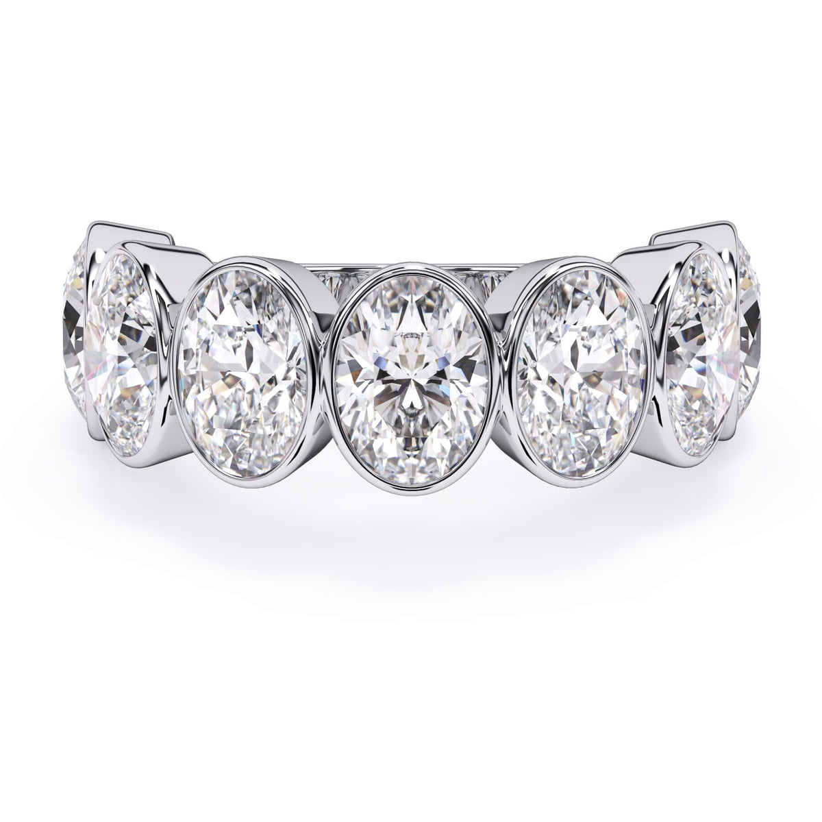 A picture of a seven stone diamond wedding ring with oval shaped diamonds that are bezel set in white gold or platinum on a white background with the ring facing forward, lying down.