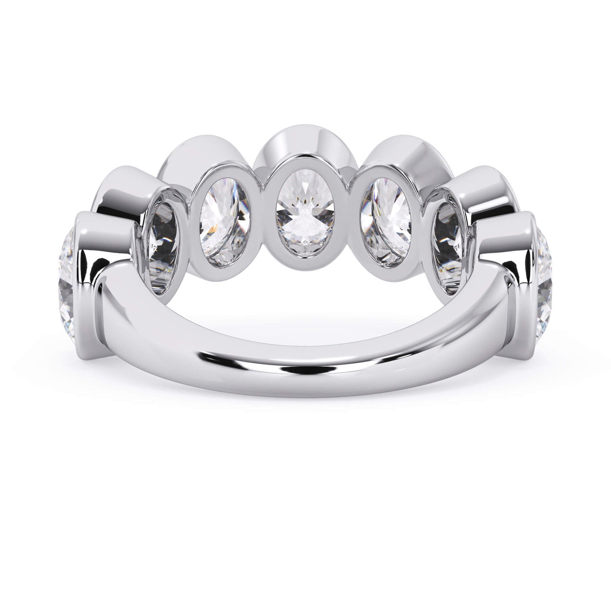 A picture of a seven stone diamond wedding ring with oval shaped diamonds that are bezel set in white gold or platinum on a white background with a view of the underside of the ring.