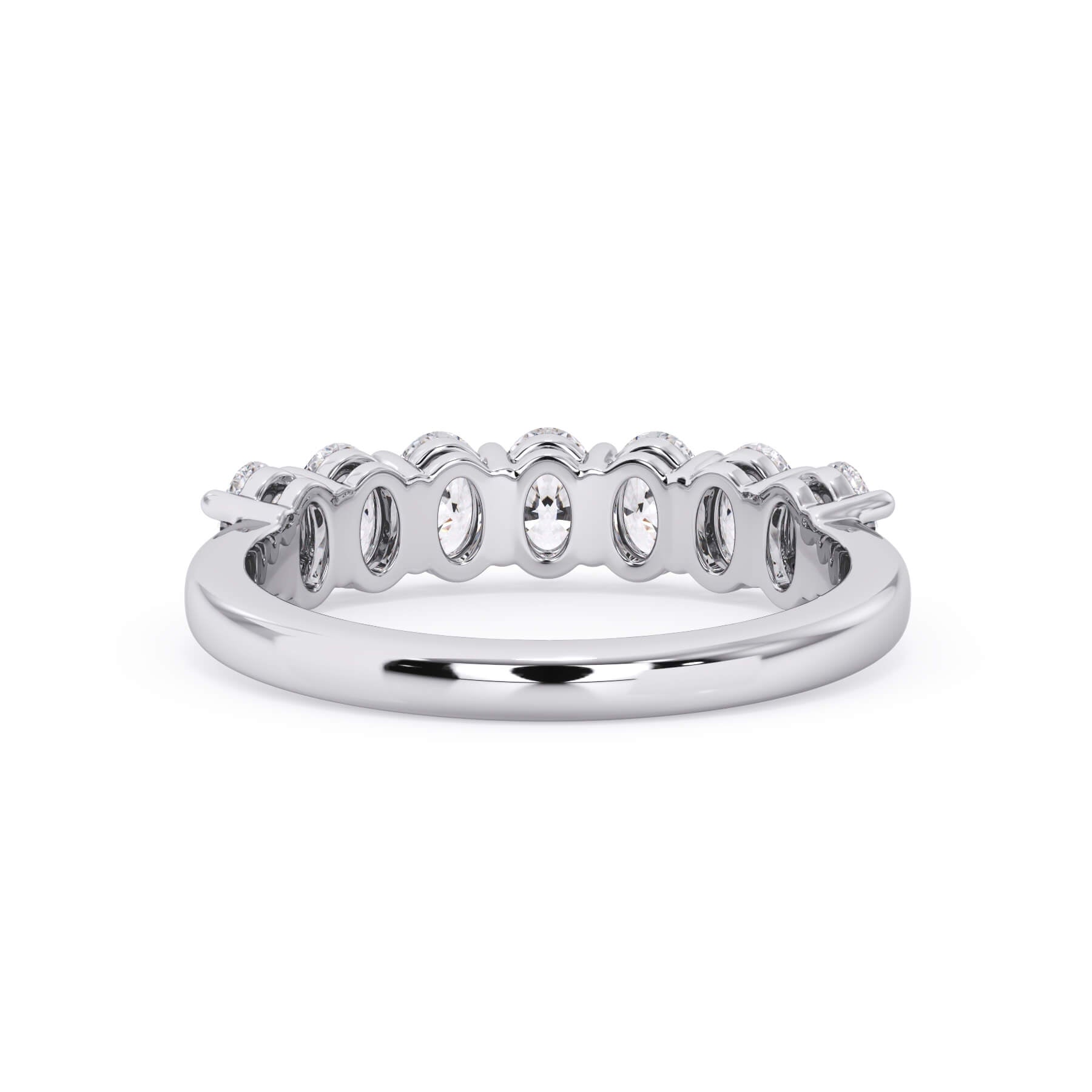A picture of a seven stone diamond wedding ring with oval shaped diamonds that are shared prong set in white gold or platinum on a white background with a view of the underside of the ring.