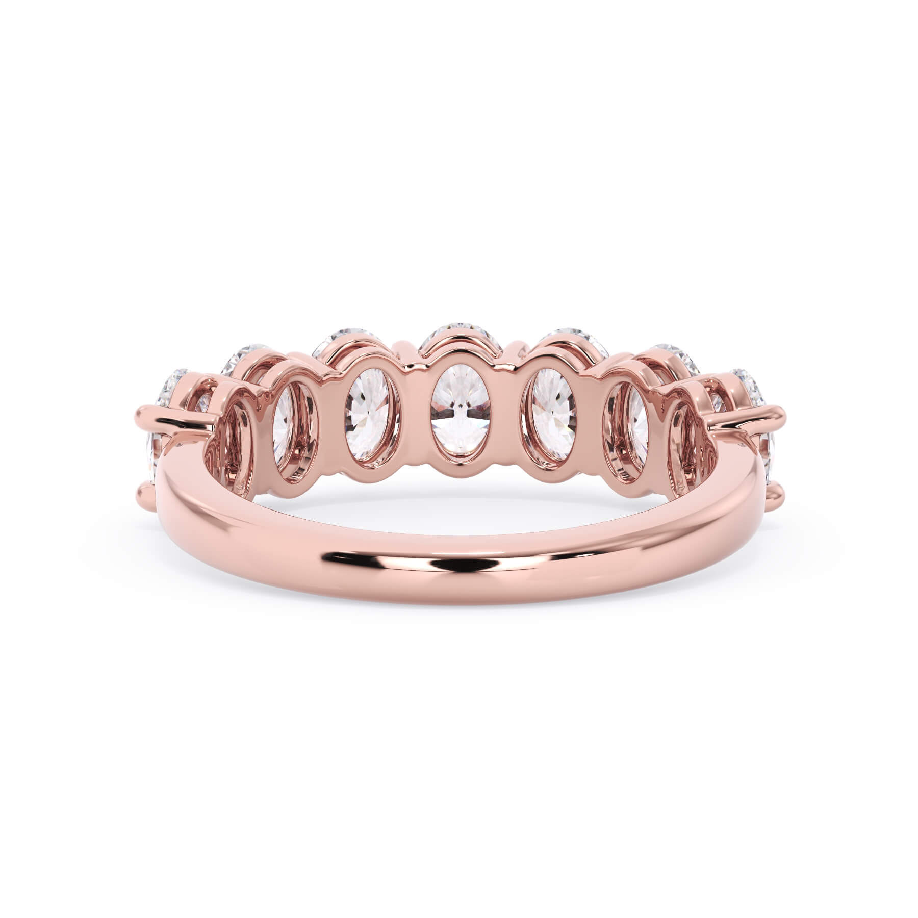 A picture of a seven stone diamond wedding ring with oval shaped diamonds that are shared prong set in rose gold on a white background with a view of the underside of the ring.
