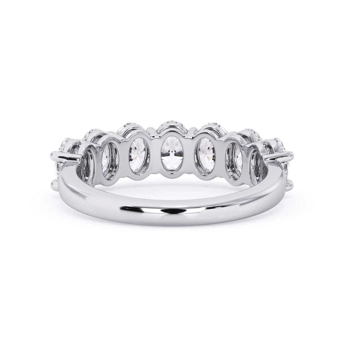 A picture of a seven stone diamond wedding ring with oval shaped diamonds that are shared prong set in white gold or platinum on a white background with a view of the underside of the ring.