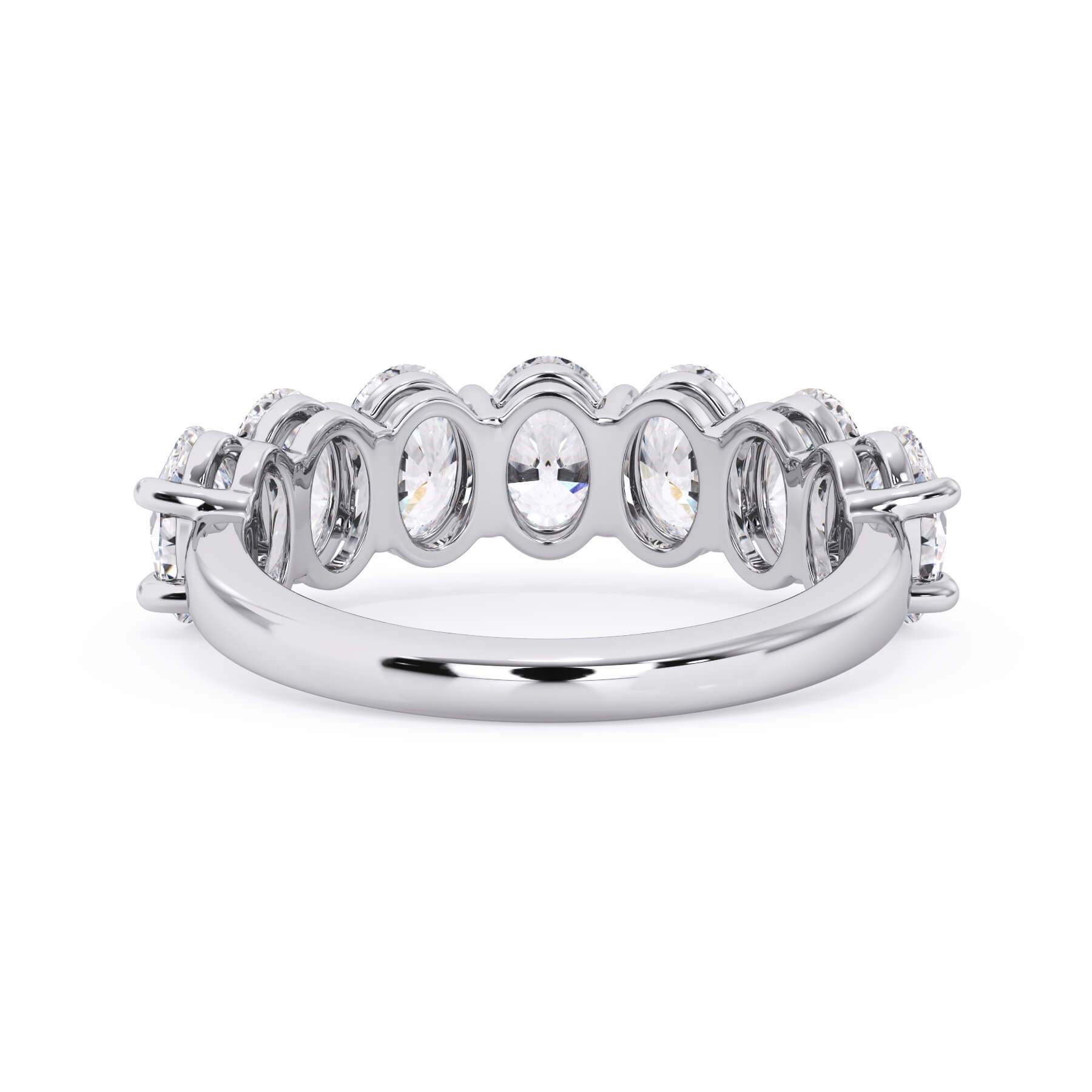 A picture of a seven stone diamond wedding ring with oval shaped diamonds that are shared prong set in white gold or platinum on a white background with a view of the underside of the ring.